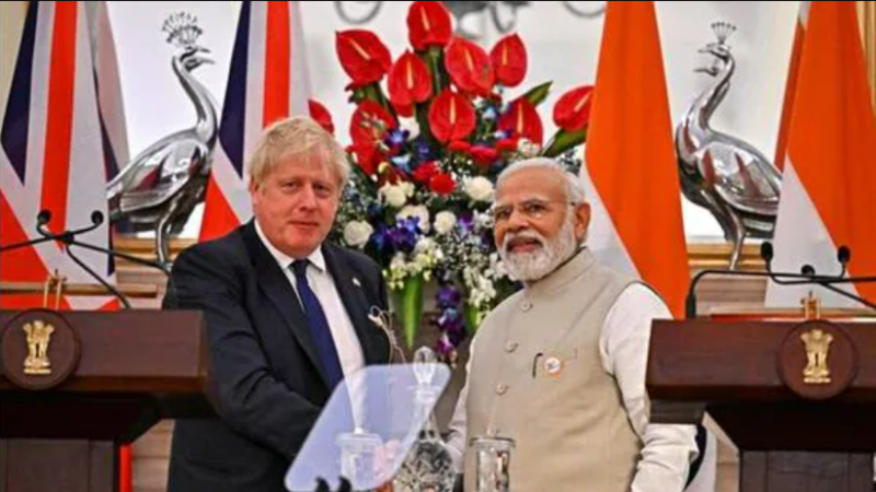 UK PM Boris Johnson shakes hands with his Indian counterpart Narendra Modi during a joint press briefing at the Hyderabad House in New Delhi on Friday, April 22, 2022. (Reuters)