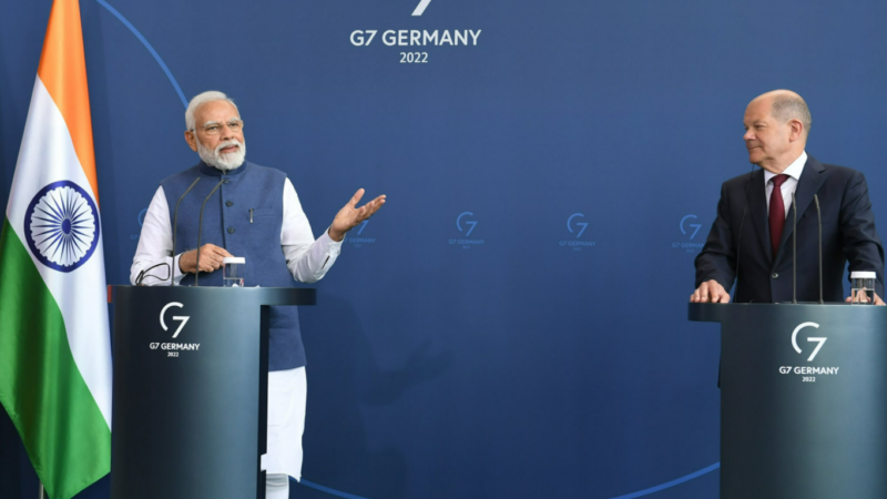 PM Narendra Modi with German Chancellor Olaf Scholz, in Berlin. PTI